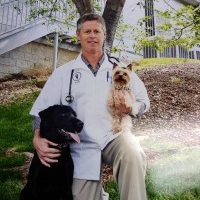 Dr. Barry Carter with two dogs
